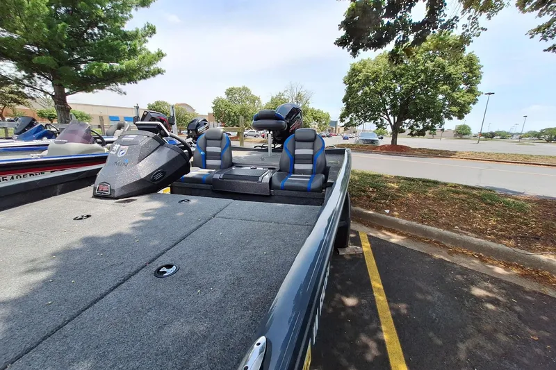Slide: The Image of 2021 Boomeranger RT188P boat parked, featuring spacious seating and modern design. - 6