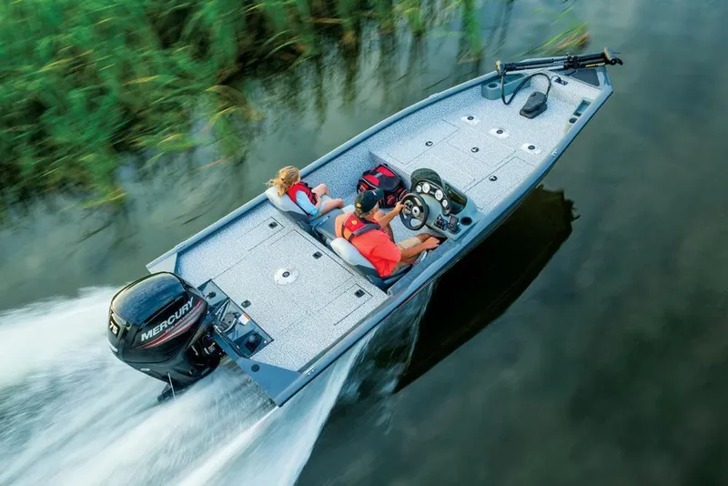 Slide: The Image of A gray motorboat speeds over calm water, with two people on board. - 11