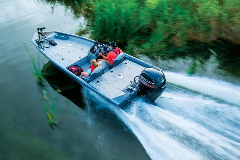 Slide: The Image of A gray motorboat speeds through a narrow waterway. - 12