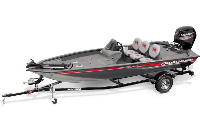 Slide: The Image of A gray Tracker boat with three seats and a Mercury engine on a trailer. - 22