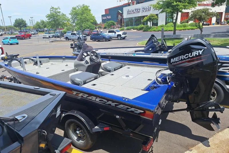 Slide: The Image of 2016 Tracker Pro Team 175 TF boat with Mercury engine in parking lot. - 3