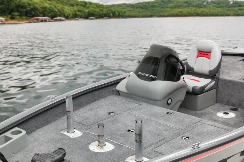 Slide: The Image of A gray boat with seating on a calm lake. - 36