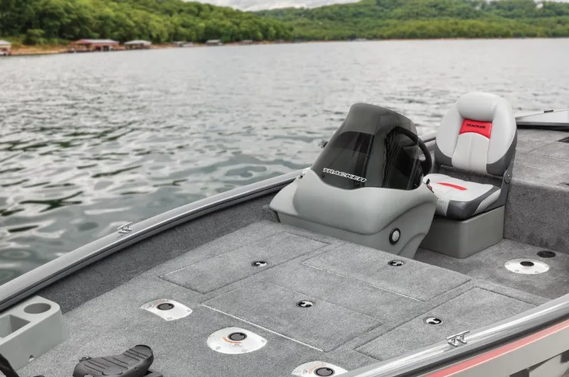 Slide: The Image of Boat on a calm lake with a gray deck and seat. - 37
