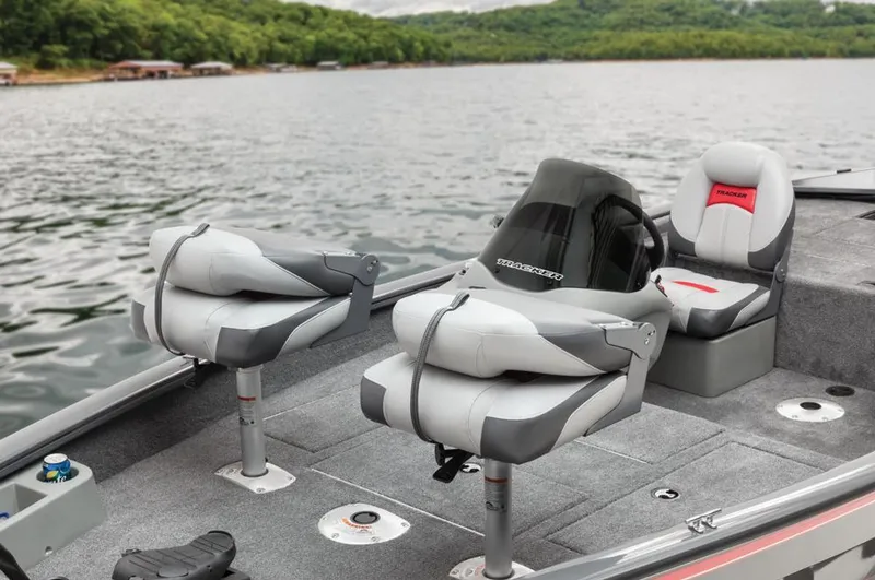 Slide: The Image of Interior view of a Tracker Pro Team 175 TF boat with gray seats on a lake. - 39