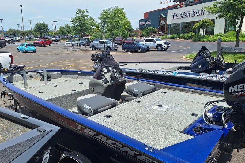 Slide: The Image of 2016 Tracker Pro Team 175 TF boat in parking lot near Tracker Boats store. - 5