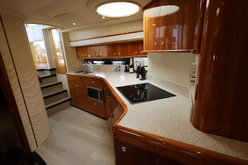 Slide: The Image of Luxurious kitchen interior of 1999 Neptunus 54 Express yacht with modern amenities. - 10