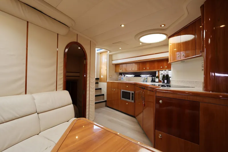 Slide: The Image of Luxurious interior of 1999 Neptunus 54 Express yacht with elegant wood finishes. - 11