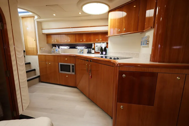 Slide: The Image of Luxurious wooden kitchen interior of 1999 Neptunus 54 Express yacht. - 12