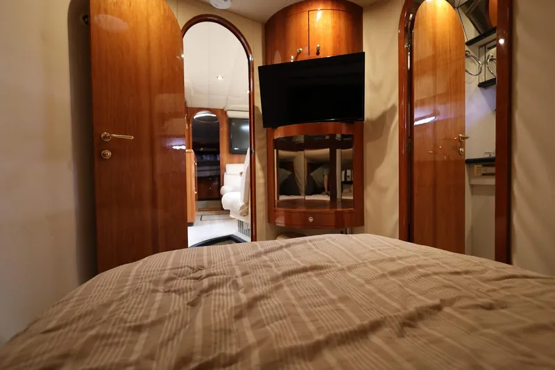 Slide: The Image of Luxurious interior of 1999 Neptunus 54 Express yacht with wood finishes and modern amenities. - 15