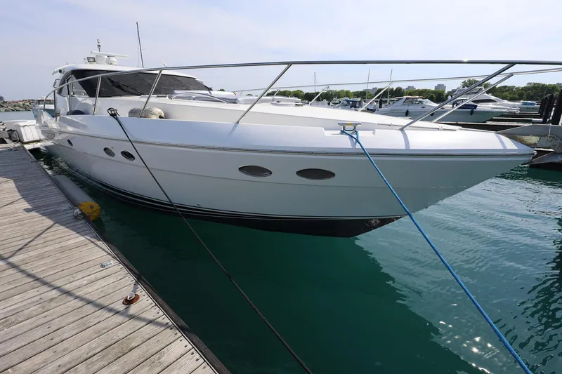 Slide: The Image of 1999 Neptunus 54 Express yacht docked at marina, side view. - 4