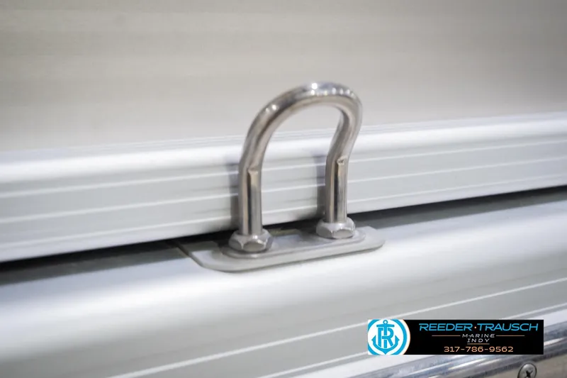 Slide: The Image of Stainless steel cleat on 2013 Bennington 2550 RBR boat, Reeder-Trausch Marine logo visible. - 70