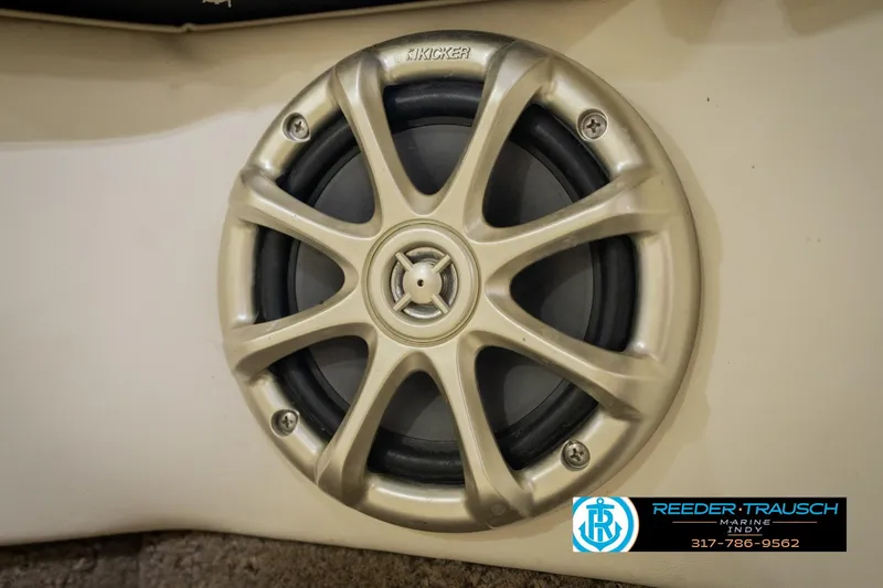 Slide: The Image of Kicker speaker on 2013 Bennington 2550 RBR boat, Reeder-Trausch Marine logo visible. - 54
