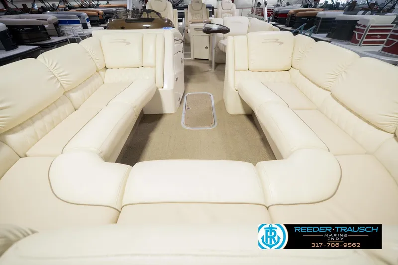 Slide: The Image of Luxurious interior of a 2013 Bennington 2550 RBR pontoon boat with cream seating. - 18