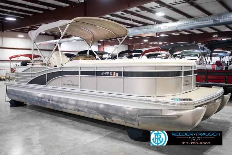 Slide: The Image of 2013 Bennington 2550 RBR pontoon boat displayed indoors at Reeder Trausch Marine. - 5