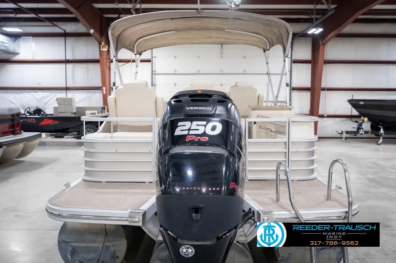 Slide: The Image of 2013 Bennington 2550 RBR pontoon boat with 250 Pro Verado engine in showroom. - 9