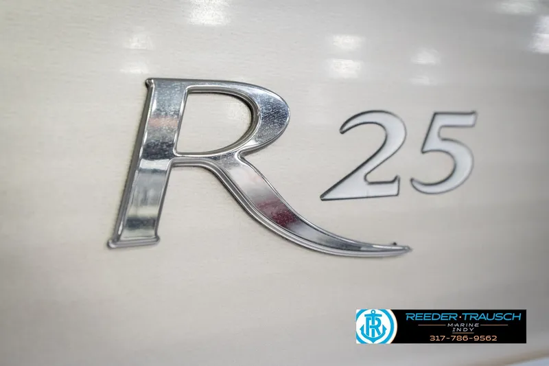 Slide: The Image of Close-up of 2013 Bennington 2550 RBR emblem with 'R25' lettering. - 67