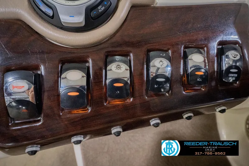 Slide: The Image of Control panel of a 2013 Bennington 2550 RBR boat with various switches. - 41