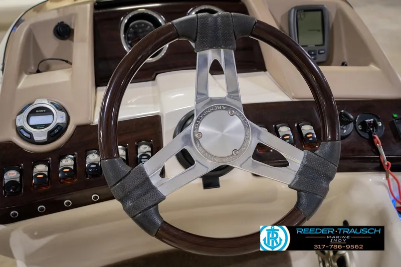 Slide: The Image of Steering wheel and dashboard of 2013 Bennington 2550 RBR boat with controls and gauges. - 39