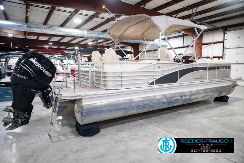 Slide: The Image of 2013 Bennington 2550 RBR pontoon boat with Mercury outboard in showroom. - 8