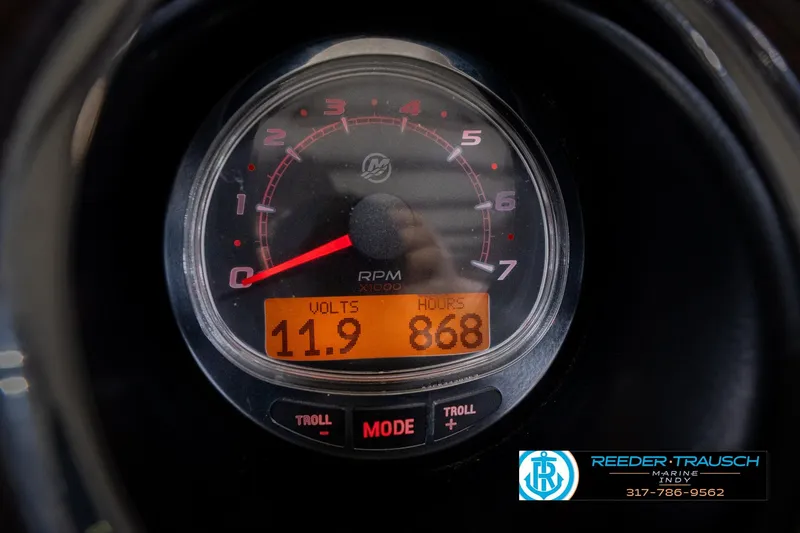 Slide: The Image of Close-up of a 2013 Bennington 2550 RBR tachometer displaying 11.9 volts and 868 hours. - 43