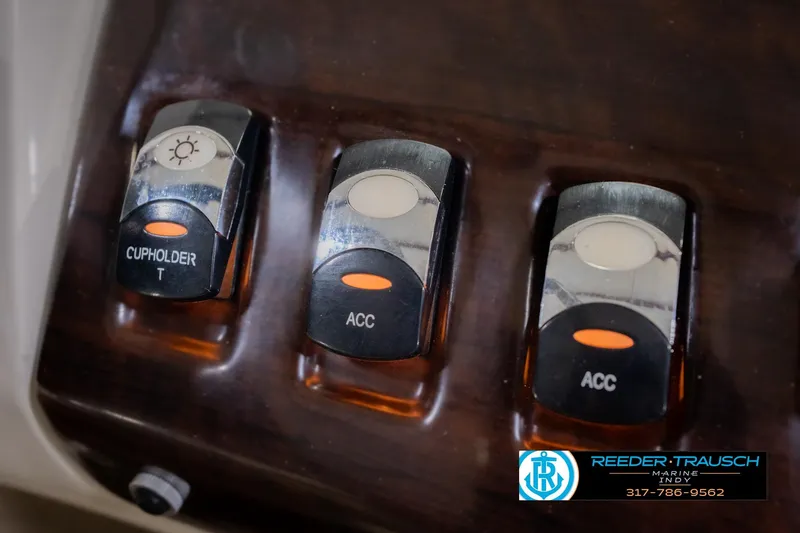 Slide: The Image of Dashboard switches on a 2013 Bennington 2550 RBR boat. - 46