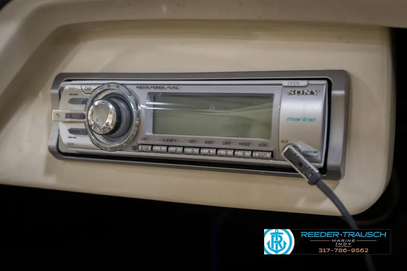 Slide: The Image of Sony marine stereo system in a 2013 Bennington 2550 RBR boat dashboard. - 56