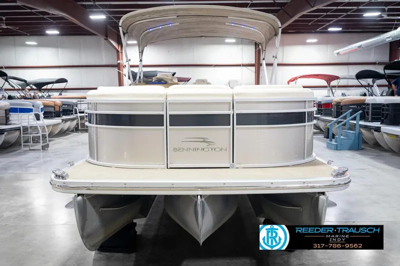 Slide: The Image of 2013 Bennington 2550 RBR pontoon boat in showroom, front view. - 4