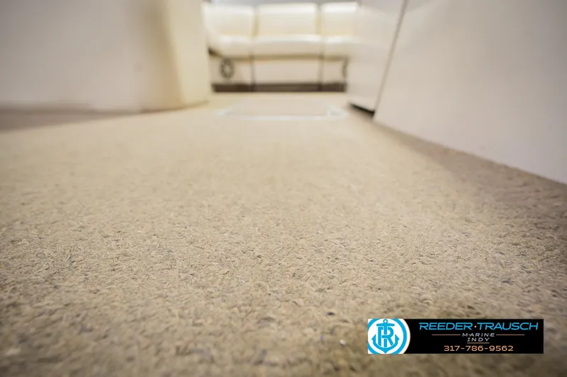 Slide: The Image of Interior view of 2013 Bennington 2550 RBR boat with carpet flooring. - 60