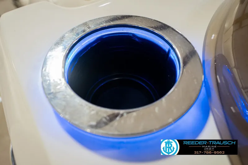 Slide: The Image of Illuminated cup holder on 2013 Bennington 2550 RBR boat, featuring blue LED lighting. - 55
