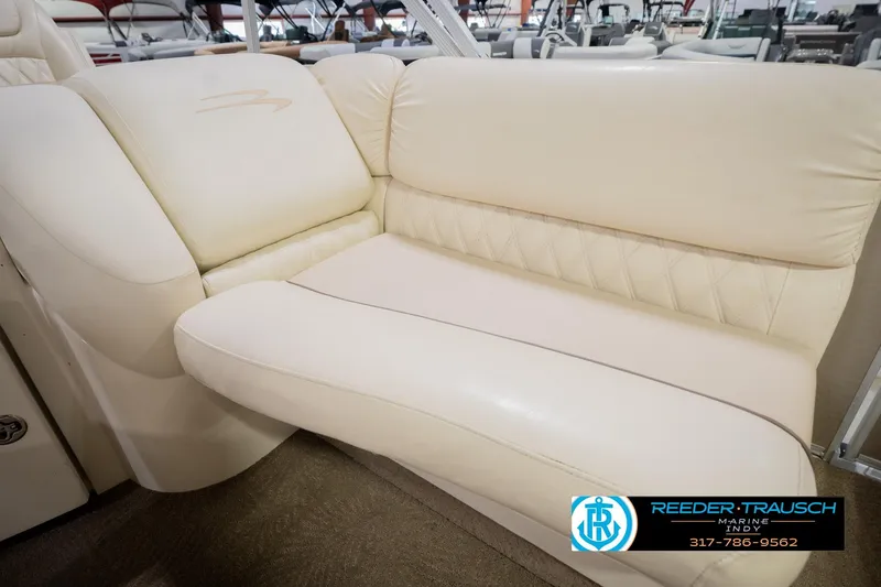 Slide: The Image of Luxurious seating on a 2013 Bennington 2550 RBR boat, featuring cream upholstery. - 51