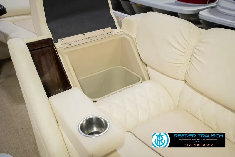 Slide: The Image of Luxurious seating on 2013 Bennington 2550 RBR boat with built-in storage and cup holder. - 29