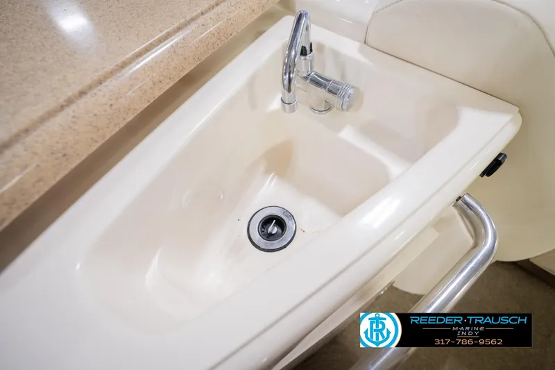 Slide: The Image of 2013 Bennington 2550 RBR boat sink with faucet and countertop detail. - 57