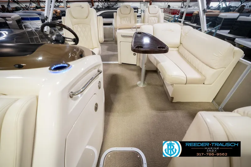 Slide: The Image of Luxurious interior of a 2013 Bennington 2550 RBR pontoon boat with plush seating and sleek design. - 20