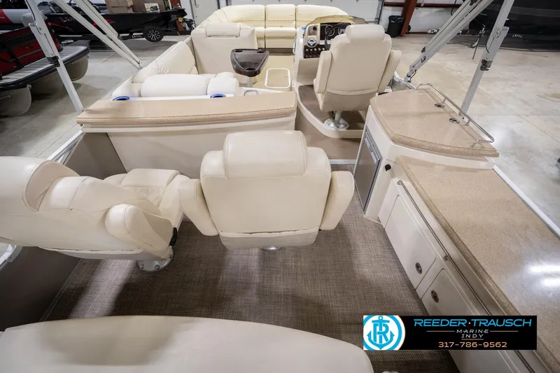Slide: The Image of Luxurious interior of 2013 Bennington 2550 RBR pontoon boat with plush seating and helm. - 22