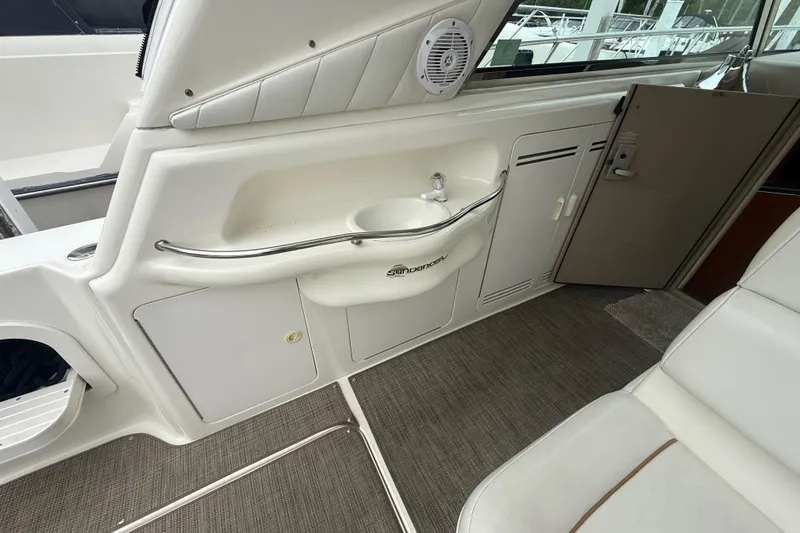 Slide: The Image of Interior of a 1998 Sea Ray Sundancer 400 yacht with sink and seating area. - 13