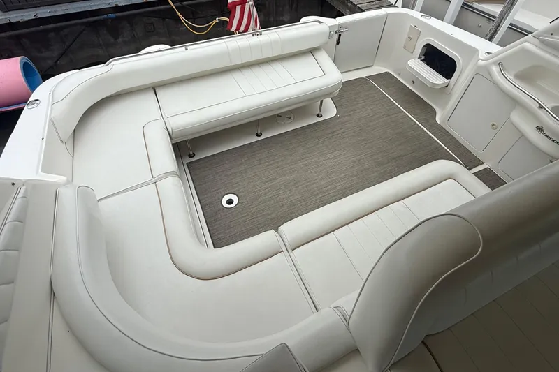 Slide: The Image of Spacious seating area on a 1998 Sea Ray Sundancer 400 yacht with white upholstery. - 14