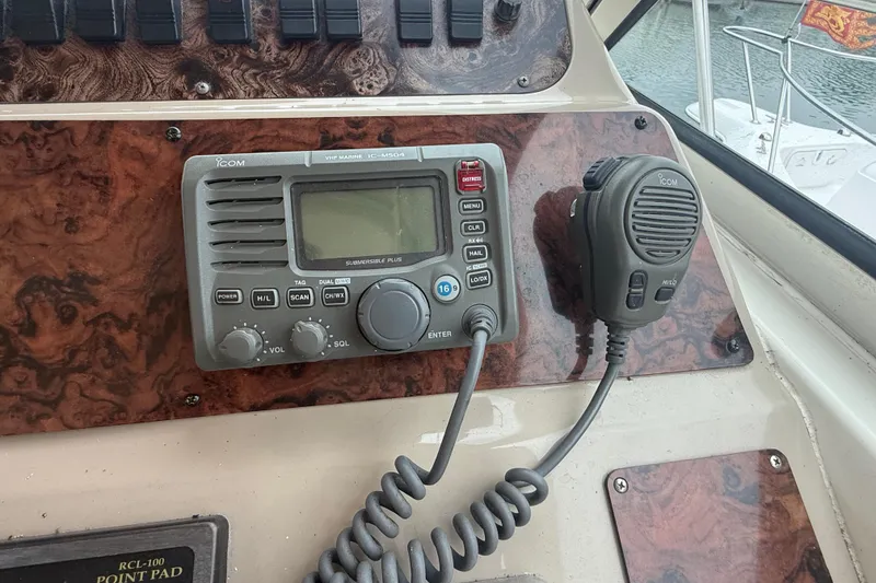 Slide: The Image of VHF marine radio on 1998 Sea Ray Sundancer 400 boat dashboard. - 21
