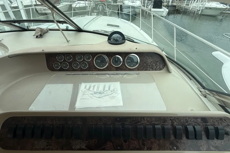 Slide: The Image of Control panel of a 1998 Sea Ray Sundancer 400 yacht at a marina. - 22