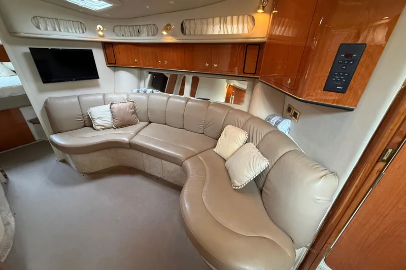 Slide: The Image of Luxurious interior of 1998 Sea Ray Sundancer 400 yacht with leather seating and wood cabinetry. - 28