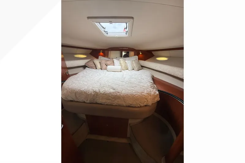 Slide: The Image of Luxurious cabin interior of 1998 Sea Ray Sundancer 400 yacht with cozy bedding. - 29