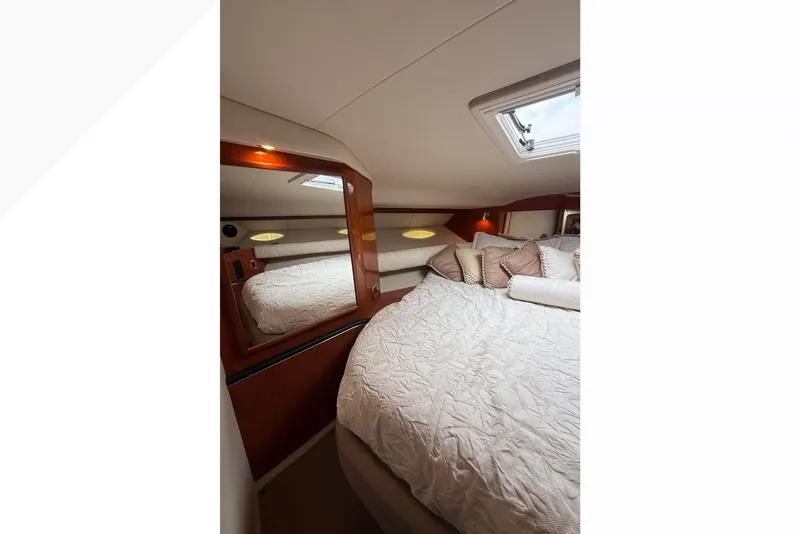Slide: The Image of Luxurious cabin interior of 1998 Sea Ray Sundancer 400 yacht with plush bedding. - 31