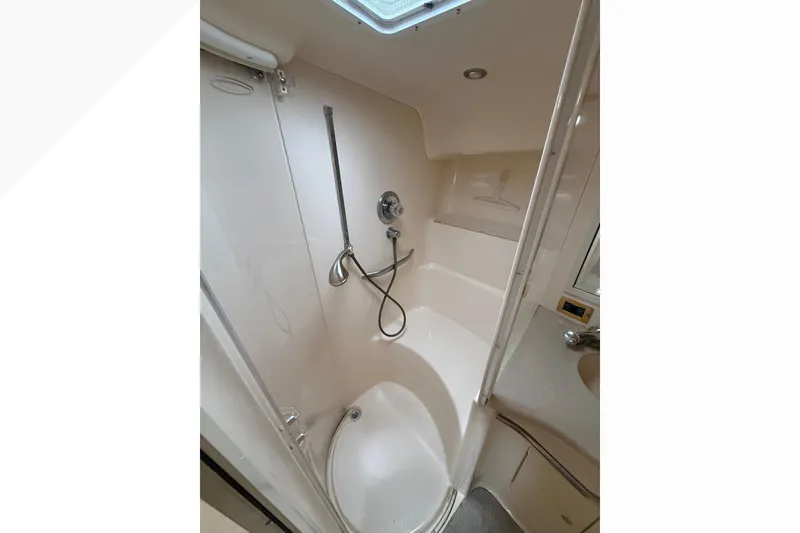 Slide: The Image of Bathroom interior of 1998 Sea Ray Sundancer 400 yacht, featuring shower and sink. - 32