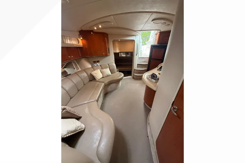 Slide: The Image of Luxurious interior of a 1998 Sea Ray Sundancer 400 yacht with plush seating and elegant cabinetry. - 34