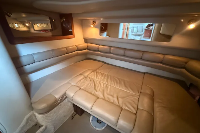 Slide: The Image of Interior of 1998 Sea Ray Sundancer 400 yacht with beige leather seating and ambient lighting. - 36