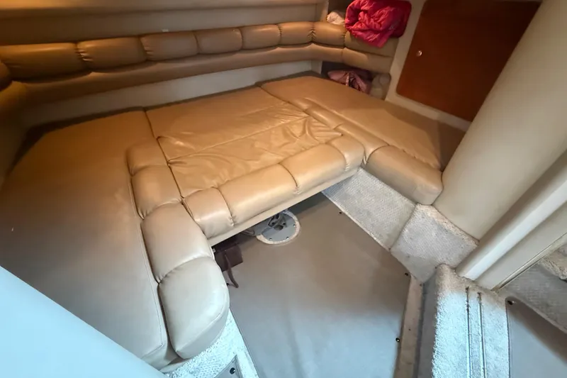 Slide: The Image of Interior cabin of 1998 Sea Ray Sundancer 400 with beige leather seating. - 37