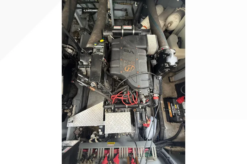 Slide: The Image of Engine compartment of a 1998 Sea Ray Sundancer 400 boat, featuring a V8 engine. - 40