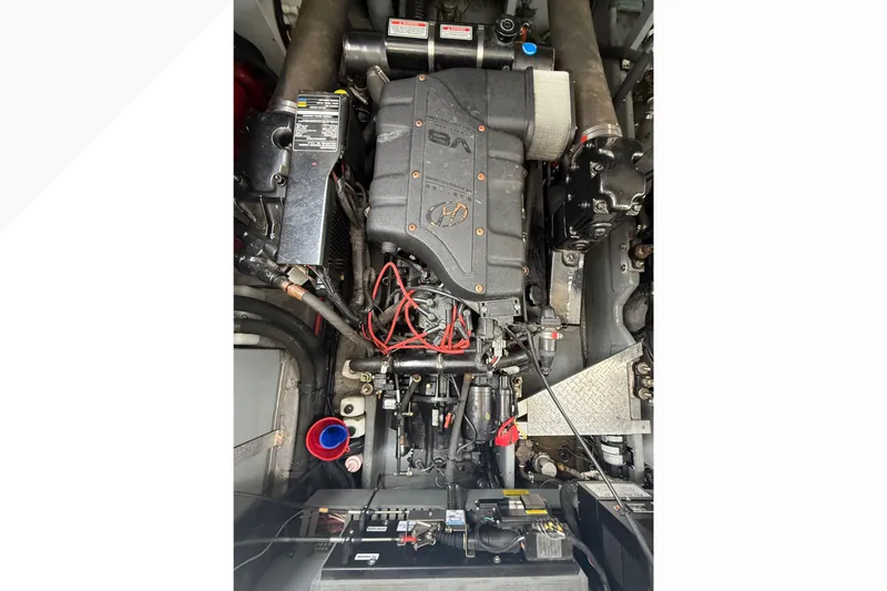 Slide: The Image of Engine compartment of a 1998 Sea Ray Sundancer 400 boat, showcasing detailed mechanical components. - 41