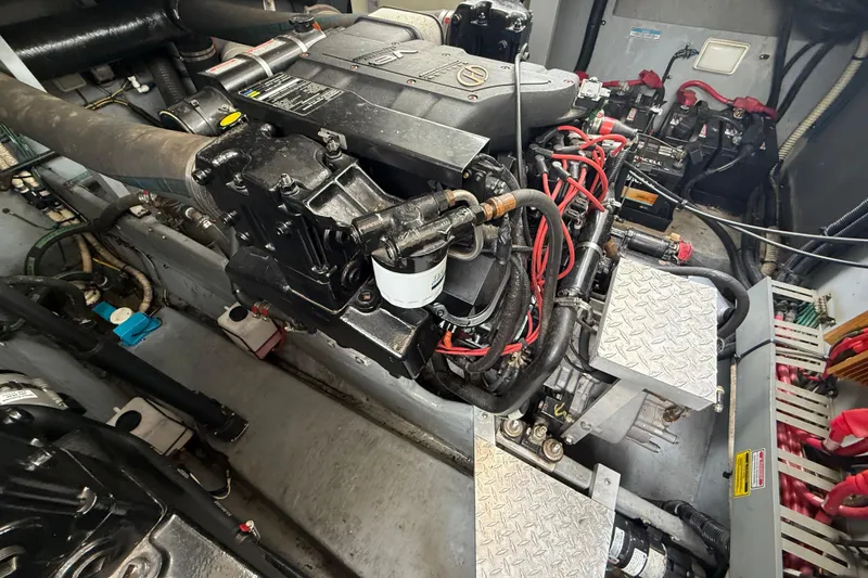 Slide: The Image of Engine room of a 1998 Sea Ray Sundancer 400 with visible machinery and components. - 42