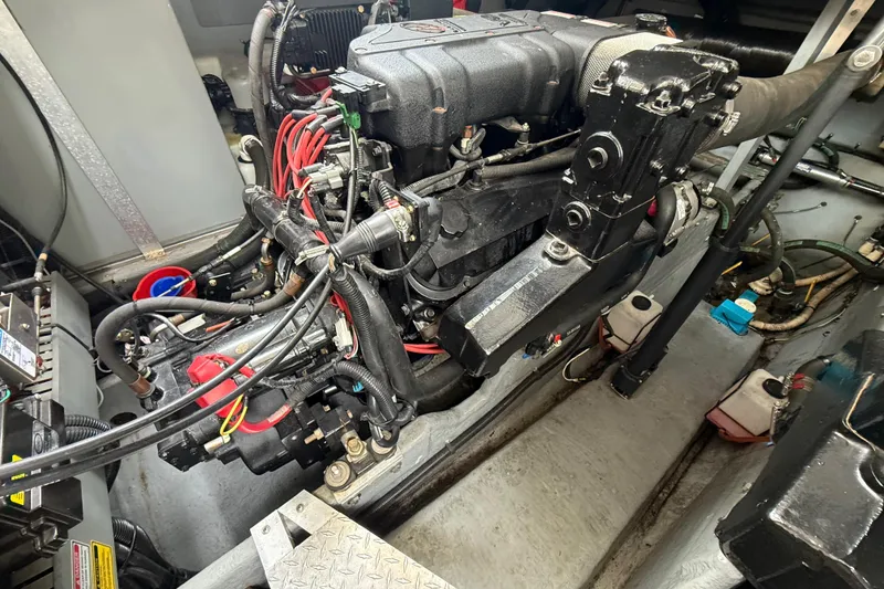 Slide: The Image of Engine compartment of a 1998 Sea Ray Sundancer 400, showcasing detailed mechanical components. - 43