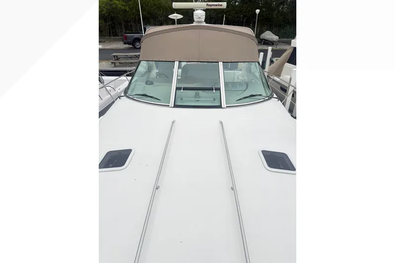 Slide: The Image of 1998 Sea Ray Sundancer 400 yacht with sleek white deck and tinted windshield. - 6